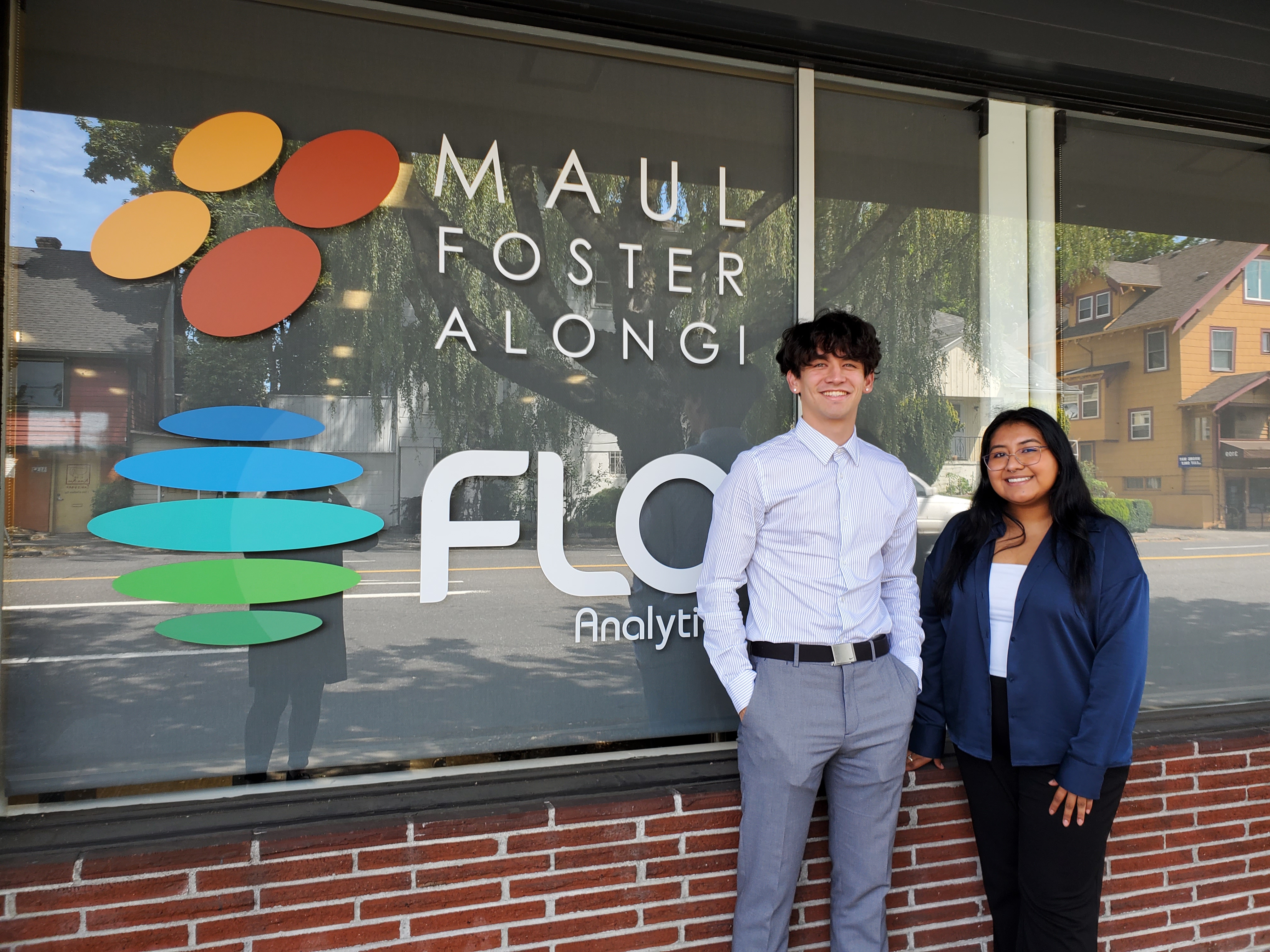 Interns Buddy and Ruby standing in front of the MFA and FLO office in Vancouver, Washington 