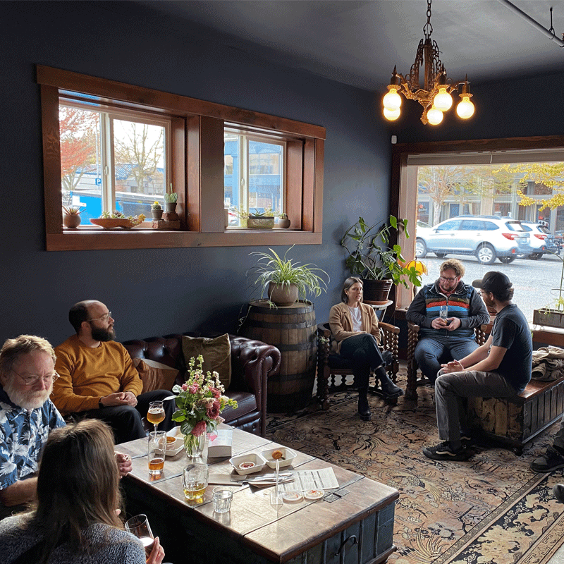 Group of people in a room talking.