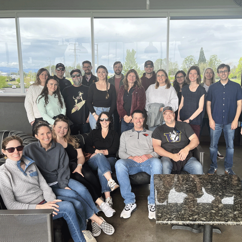 Group of employees posing for a photograph.