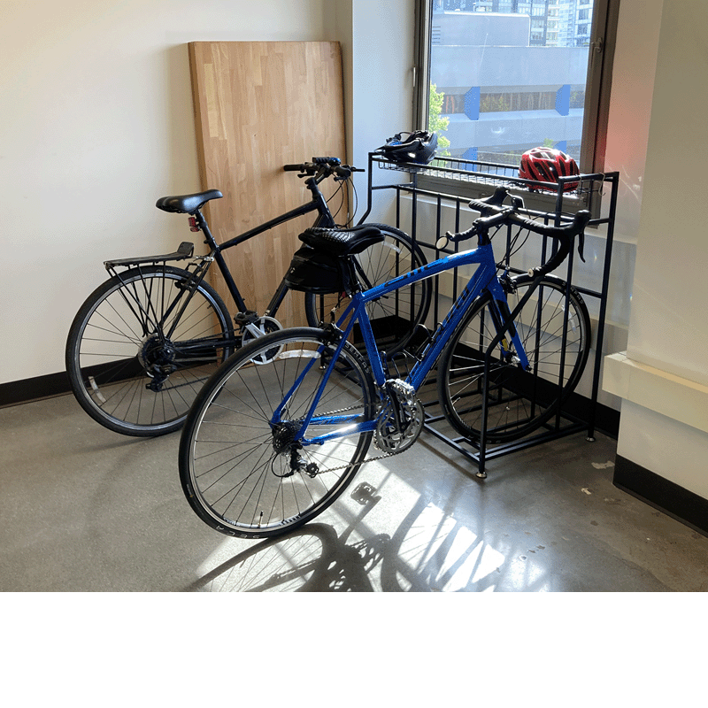 Couple of bicycles in an office.