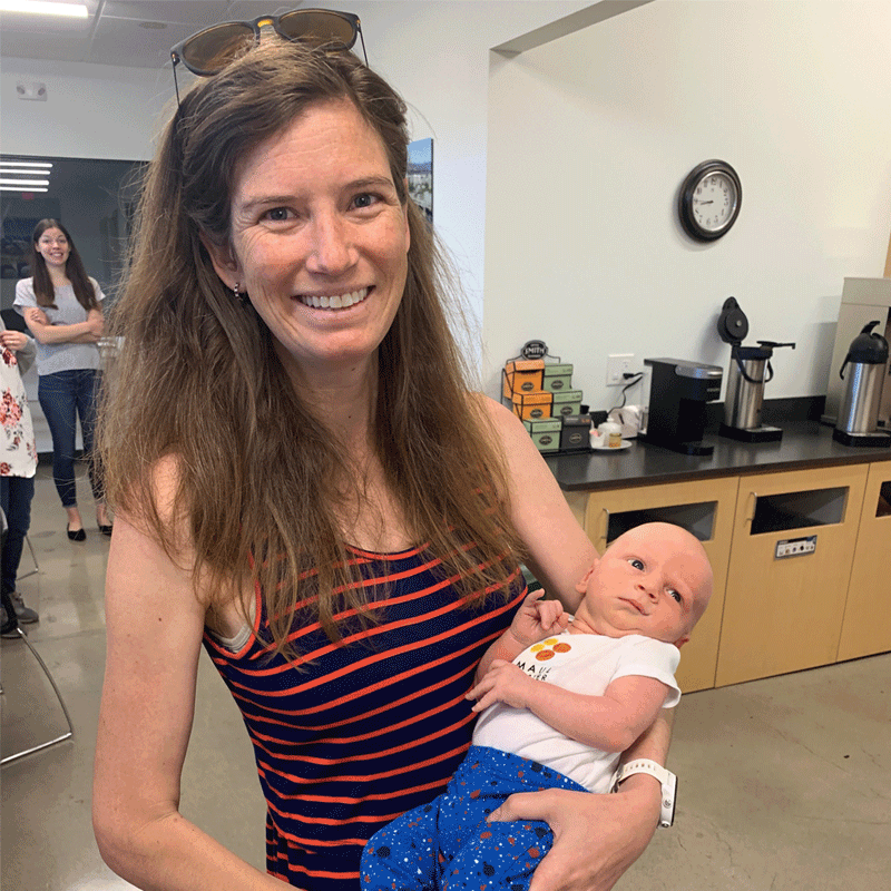 Woman holding a baby.