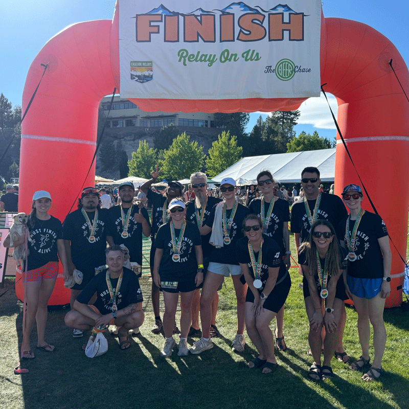 MFA team members at a finish line.