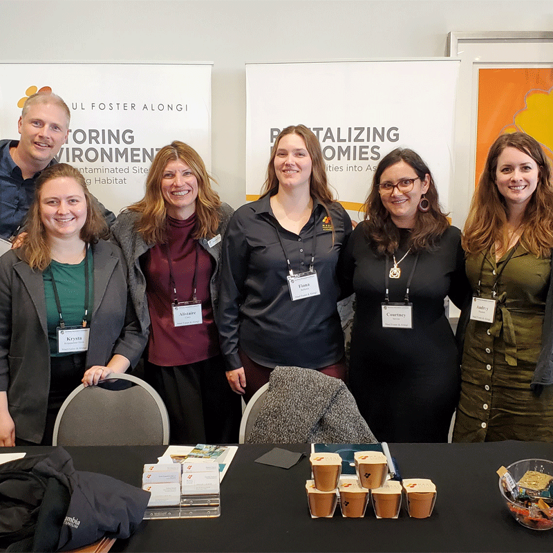 Group of MFA team members at a conference.