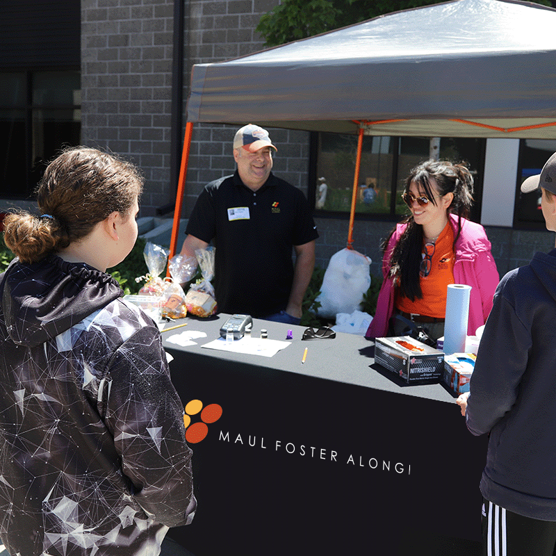 Team members at a booth