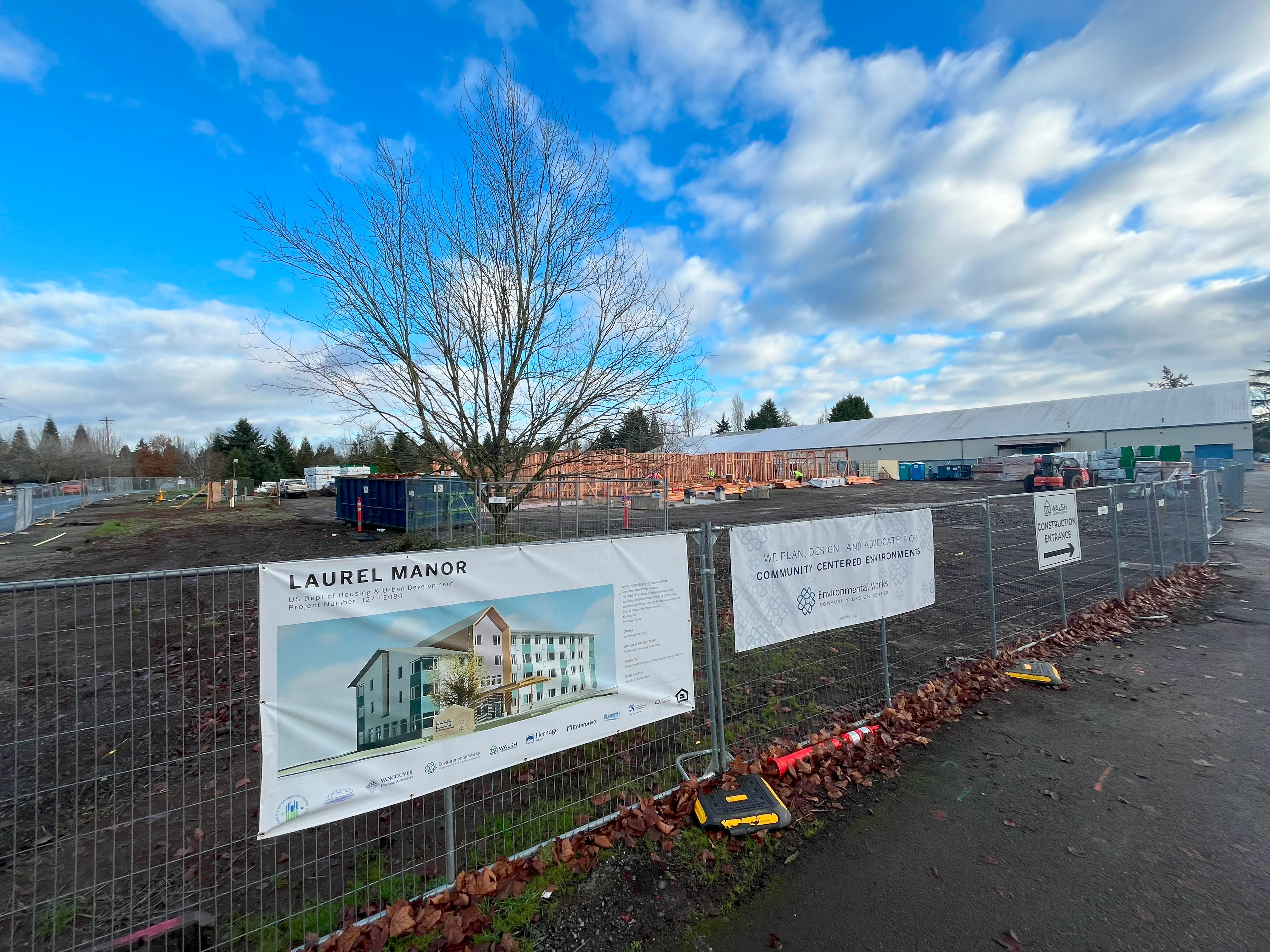 construction site with fence and sign