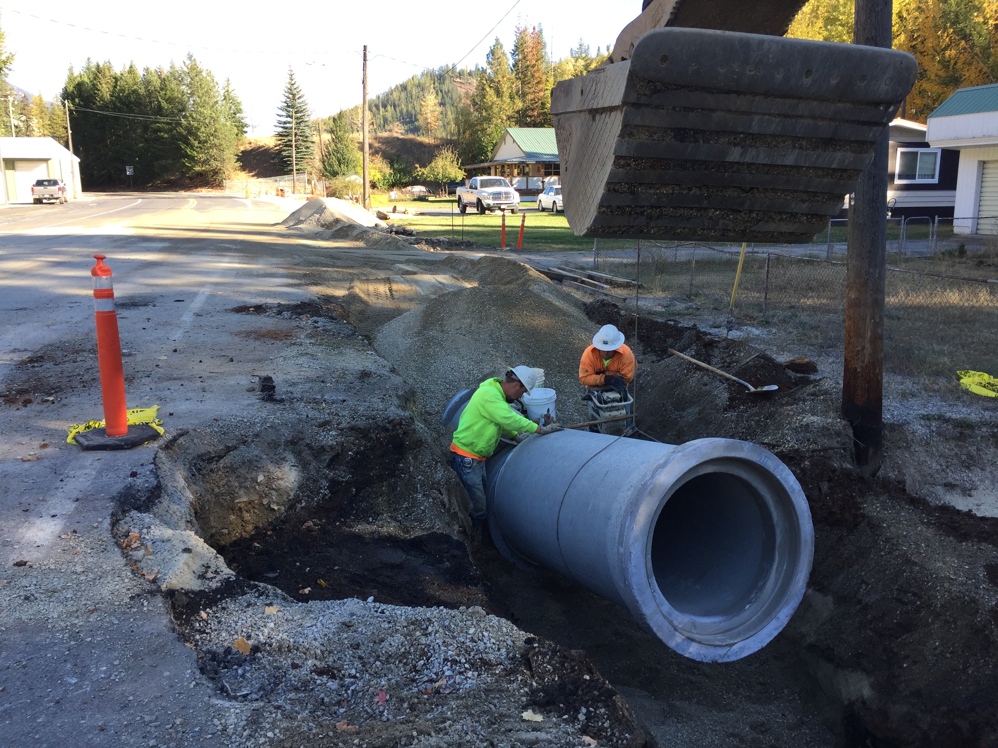 Construction Workers Remove Pipe