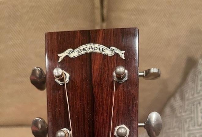 "Beadie" inlay on the head of a guitar