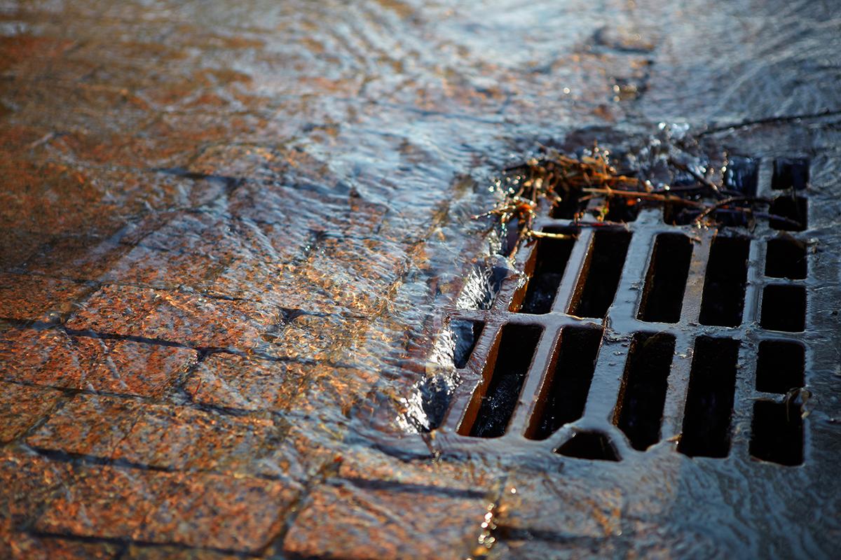 Stormwater going into a storm drain.