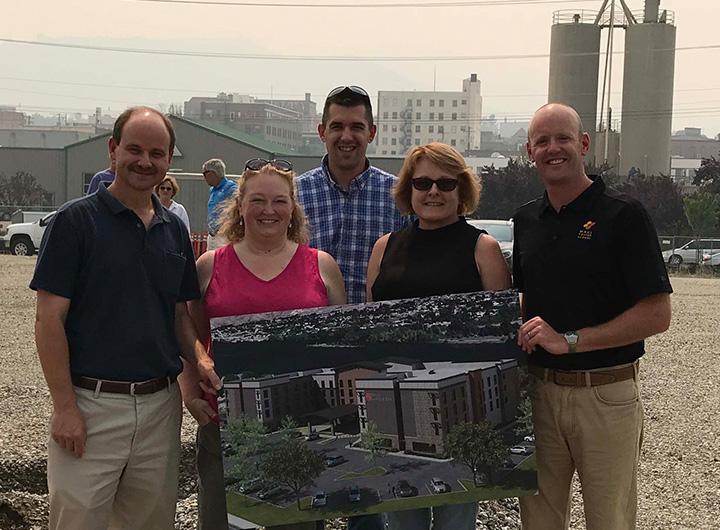 Picture of team holding project print out.