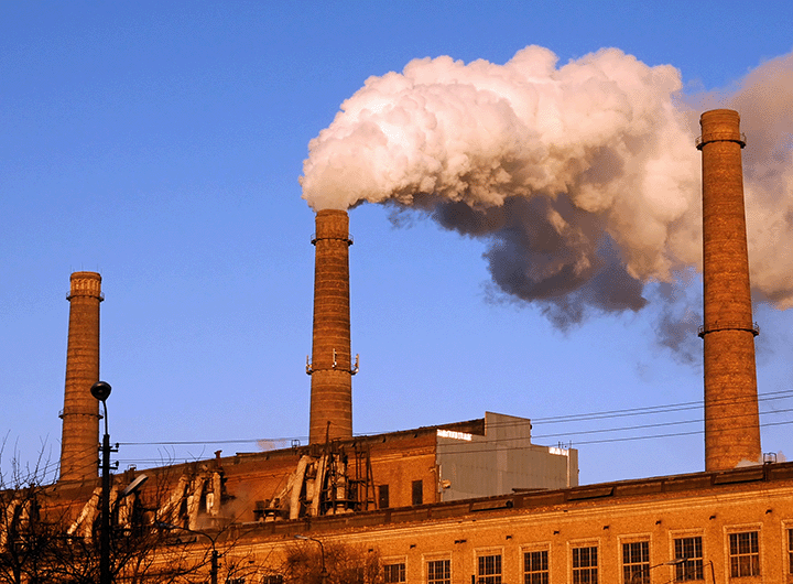 factory smokestack emitting a smoke plume