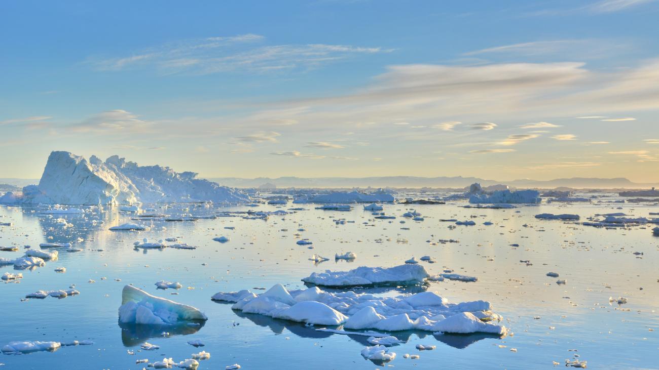 an arctic ocean with scattered ice caps