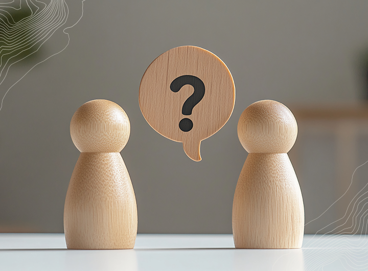 Wooden figurines with question mark